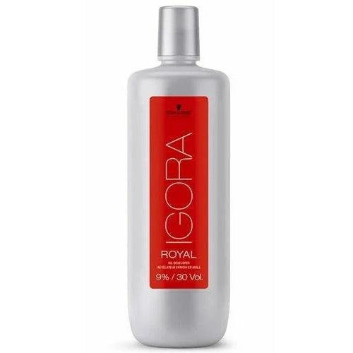 A tall, cylindrical bottle of Schwarzkopf Igora Royal gel extensions, featuring a metallic silver body and cap with a bold red label on the front.